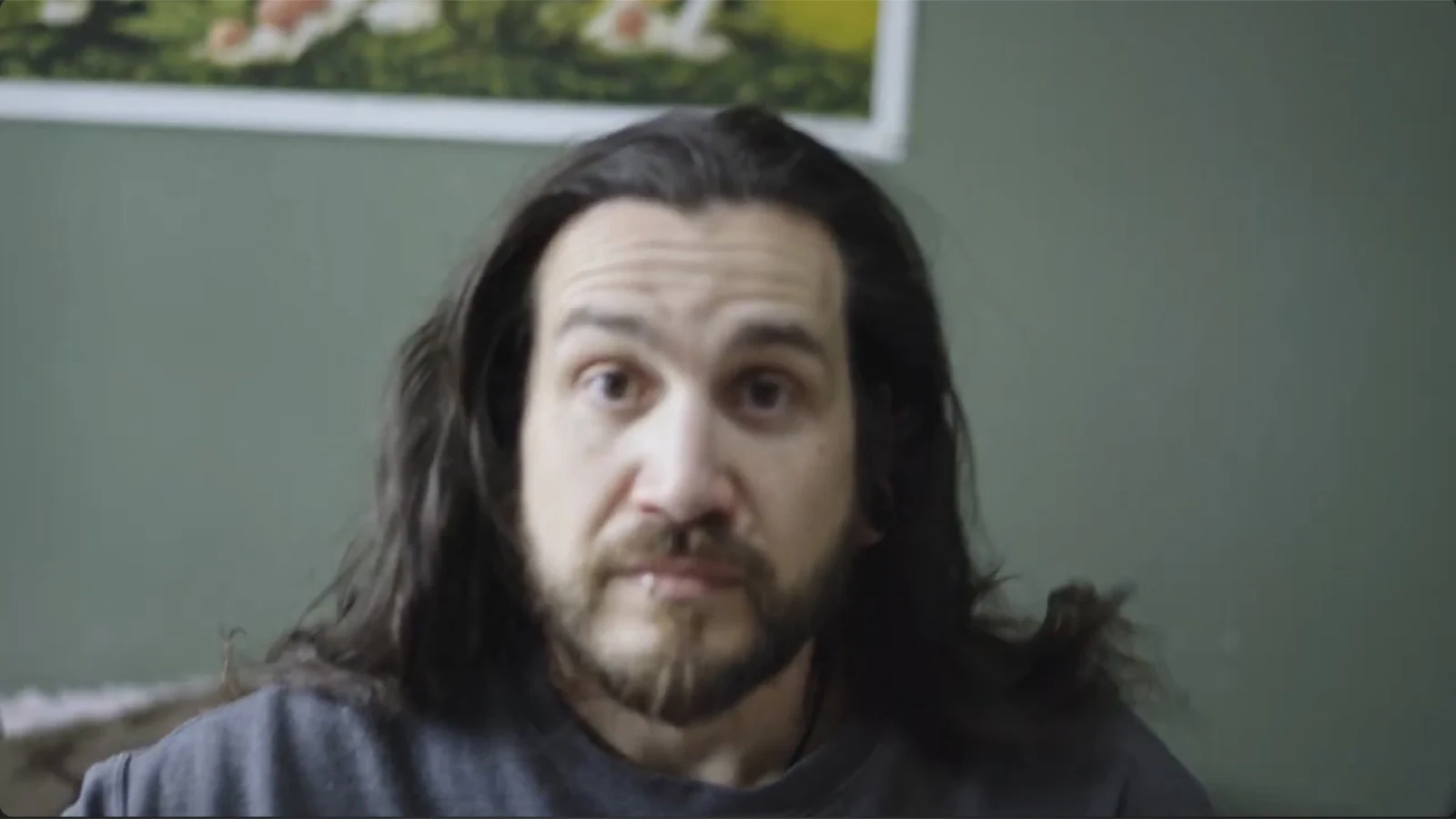 A long-haired character glancing sideways in Lookout